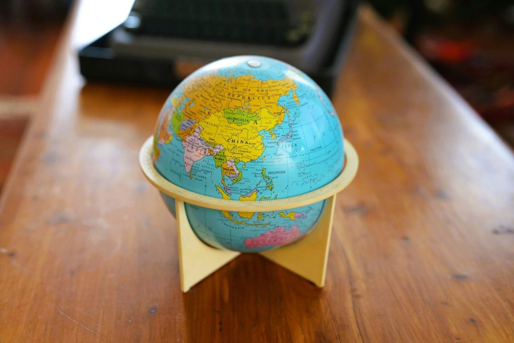 A small globe on a wooden table