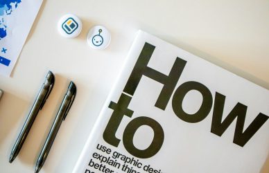 a book with a pen and a pen on top of it