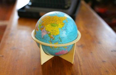 A small globe on a wooden table
